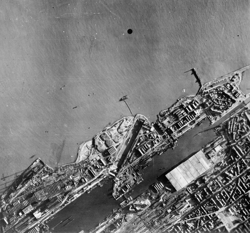 Aerial reconnaissance photo showing the remains of HMS Campbeltown in the Normandie Dock after the explosion